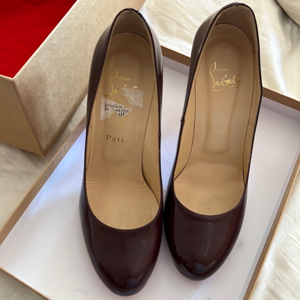 Plum colored Christian Louboutin pumps. Rounded toe very comfortable size 38.